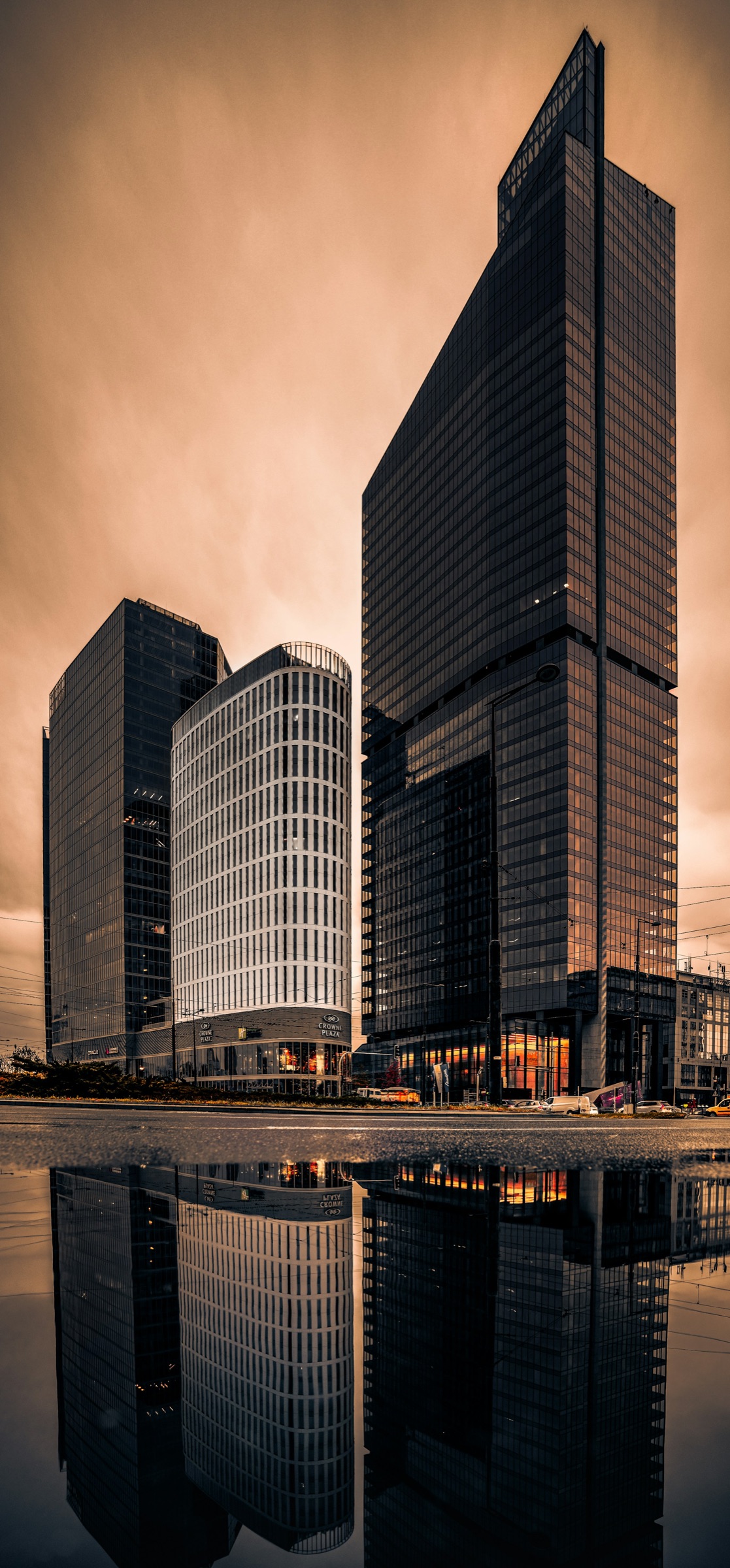 Tall curved-balcony luxury residential tower overlooking the waterfront